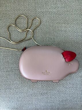 kate spade pale pink piglet crossbody with red ear and gold chain